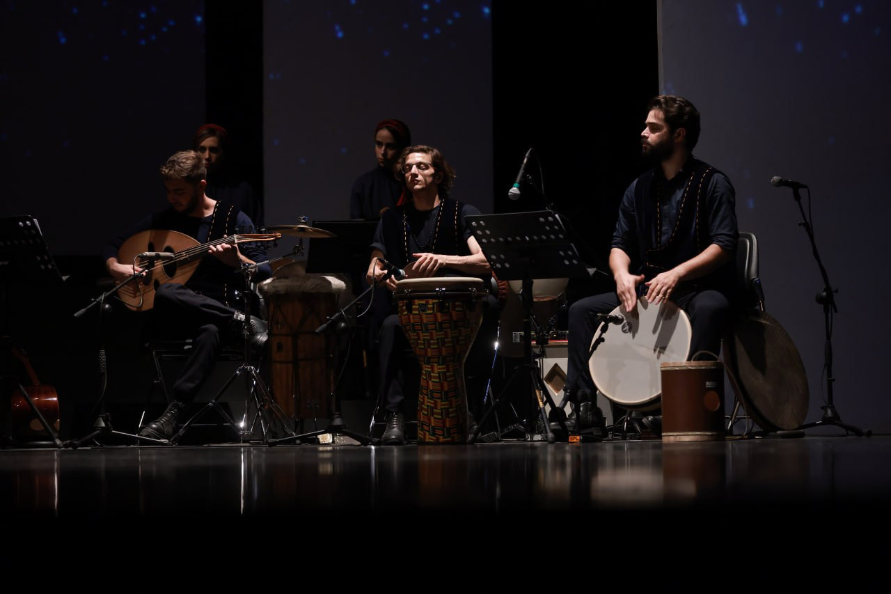 Aryan Rezaee playing the Daf as lead percussionist in the Pirouz and Parizad musical theatre at Vahdat Hall