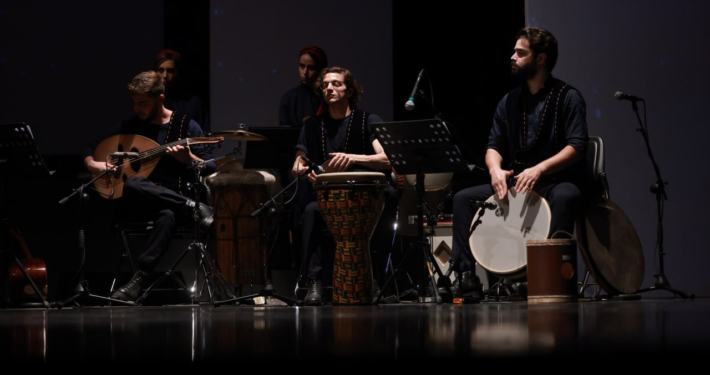 Aryan Rezaee playing the Daf as lead percussionist in the Pirouz and Parizad musical theatre at Vahdat Hall