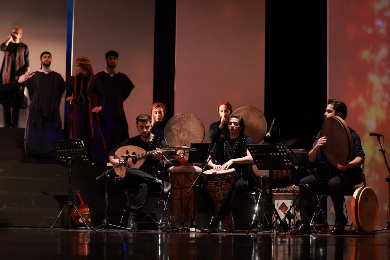 Aryan Rezaee playing the Daf as lead percussionist in the Pirouz and Parizad musical theatre at Vahdat Hall